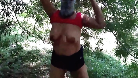 Amateur big tits brunette showing off her boobs outdoors