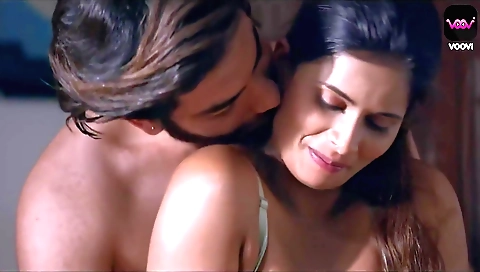 Brunette milf in her pink dress moves legs and hands around