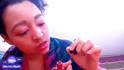 Indian hairdresser paints her nails in a solo video