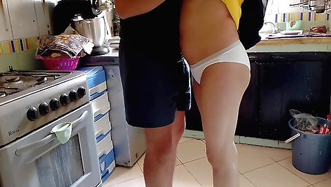 Indian housewife in a black sweater and black shorts