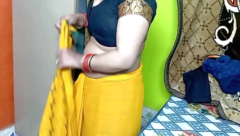 Hot solo indian in a green sari in sexy dress on camera