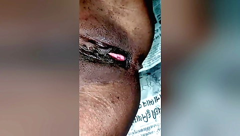 Indian woman in white dress and shorts takes it off