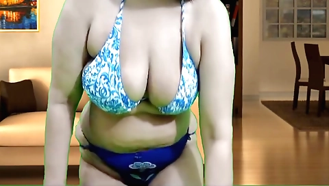 Indian hottie in a sexy outfit shows off her big ass and pussy