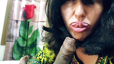 Indian woman with brown hair is licking a white dick