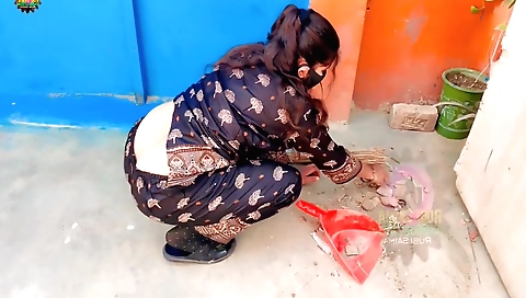Indian girl is standing on a chair in her pink bikini