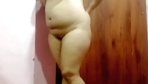 Chubby chick with big breasts masturbating in the kitchen