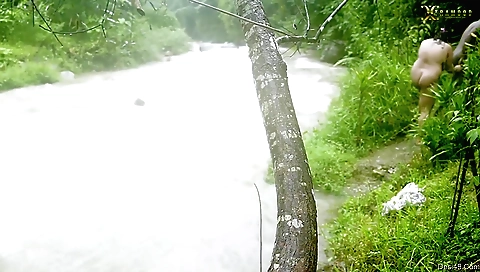 Gorgeous girl in a bikini in the river in her natural sex