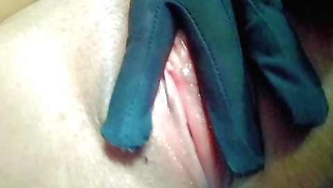 Sexy naked solo girl in a black dress shows off her cunt