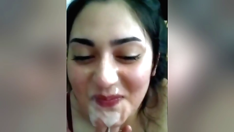 Indian girl faces guy with facial in front of camera