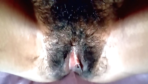 Indian amateur has a hairy pussy and she plays with it
