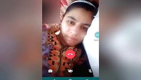 Hot brunette is wearing sexy white dress on webcam