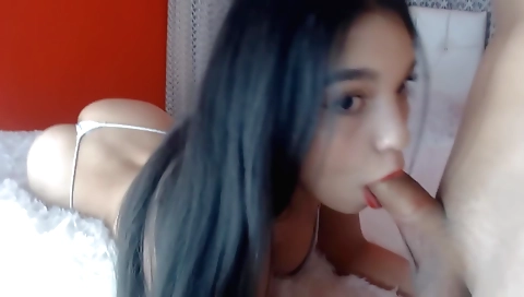 Brunette in thong is blowing on the shower in front of camera