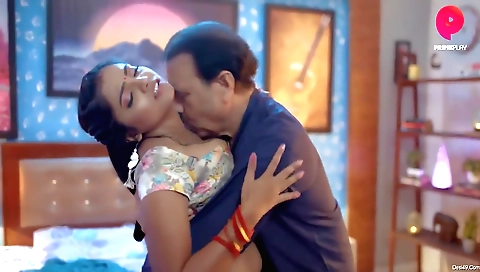 Brass-studded brunette with round round tits and big natural breasts