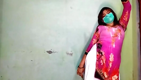 Sexy brunette dancing in front of black chair in solo