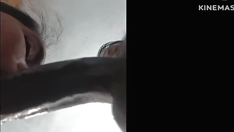 Indian girl with a nice black dress sucking a black dildo