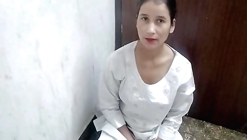 Solo female in her black dress plays with fingers and hands